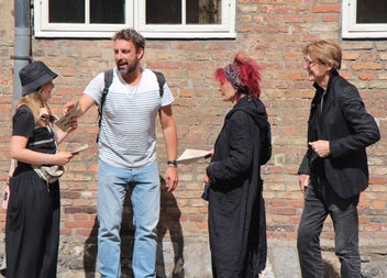 Friends with maps and clues on a Solve A Mystery Tour
