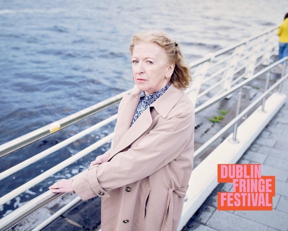 Mam and Love and Woo - Liam McCarthy. Joan Sheehy standing on a quay by a river