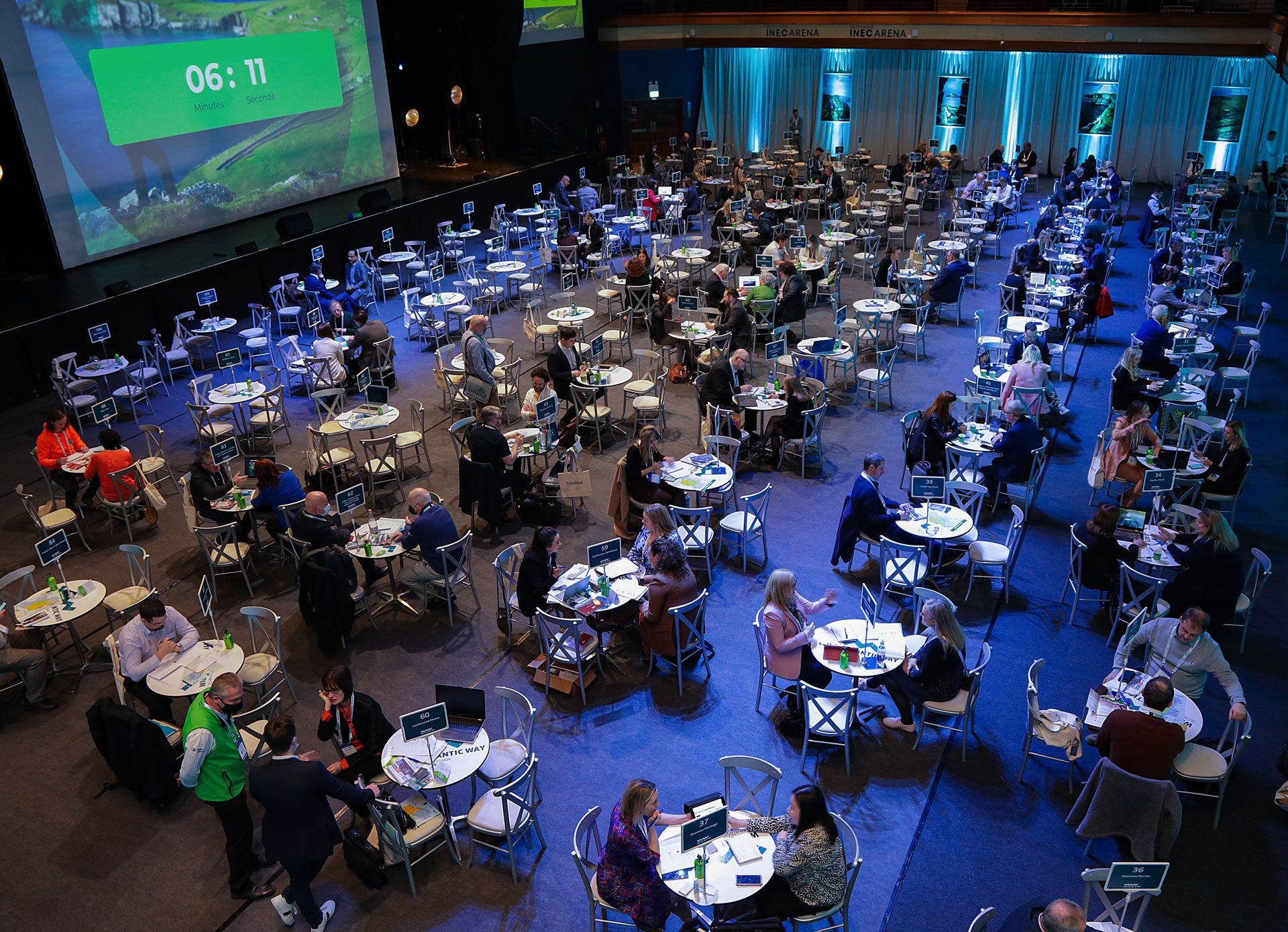 Killarney Convention Centre (INEC) interior with small tables set up 