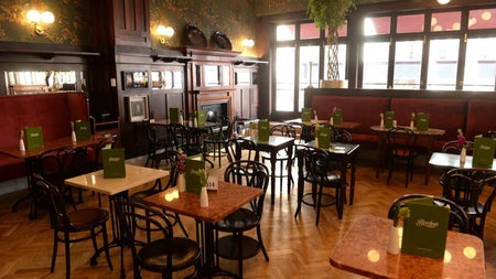 Interior of an empty dining area with tables and chairs