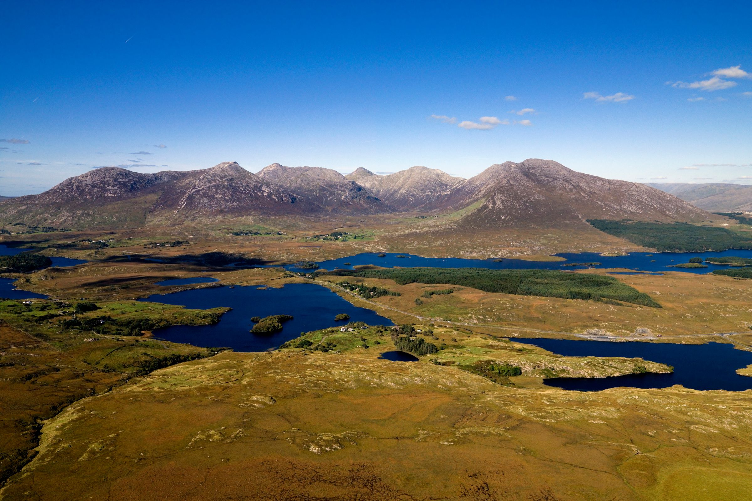 Mountains behind the blue water of Derryclare Lough