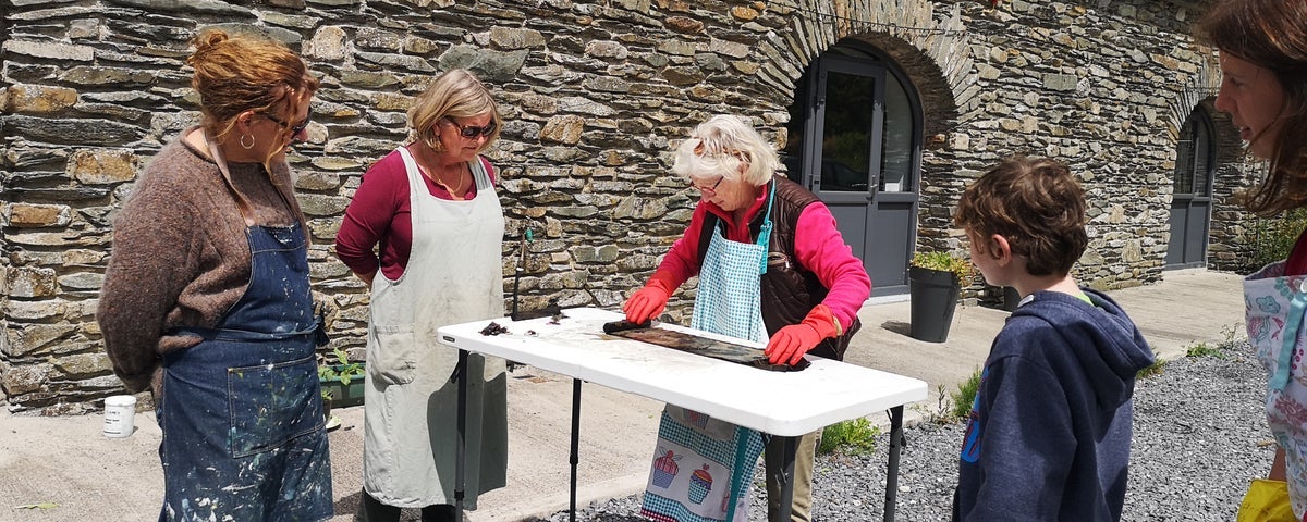 A small family group participating in a workshop