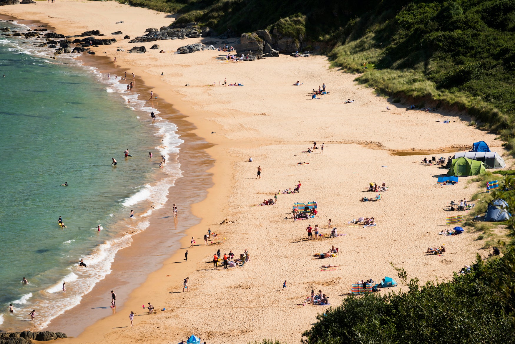 Aerial view of people on Kinnagoe Bay in Co Donegal