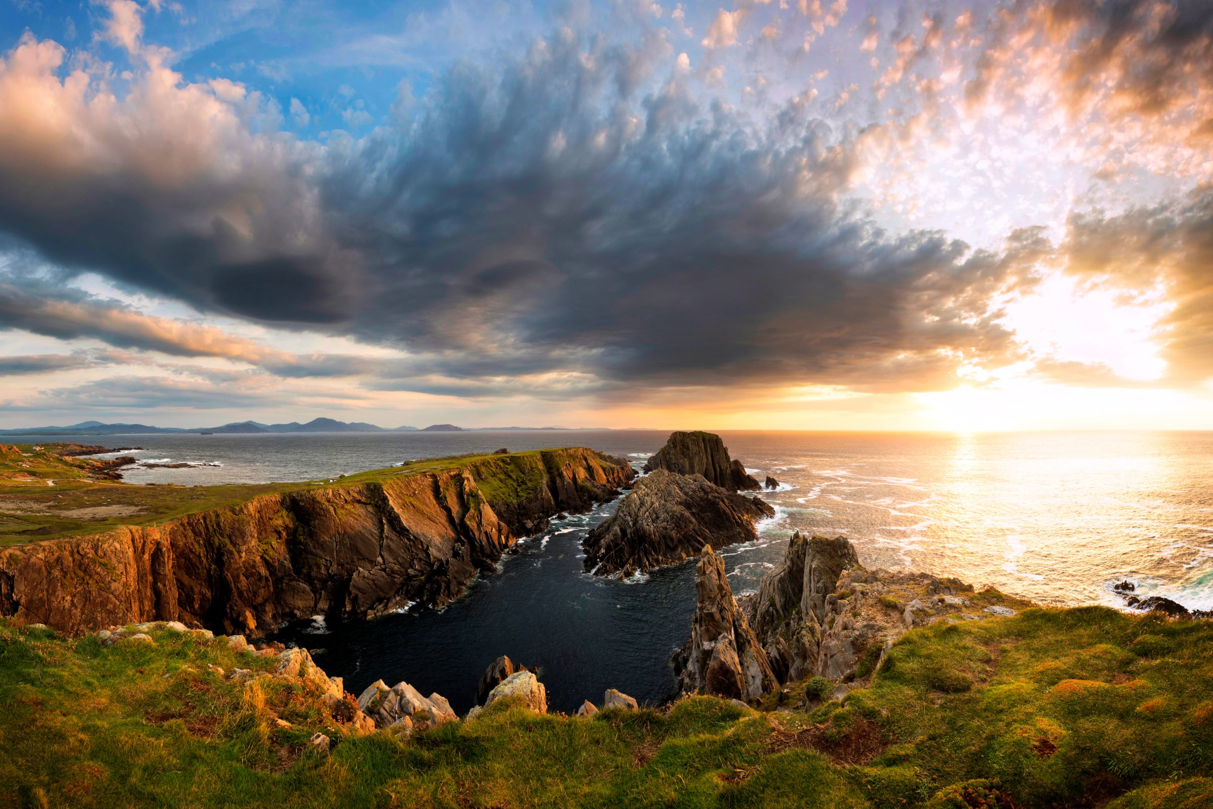 A sunset behind rocks at Malin Head in Donegal