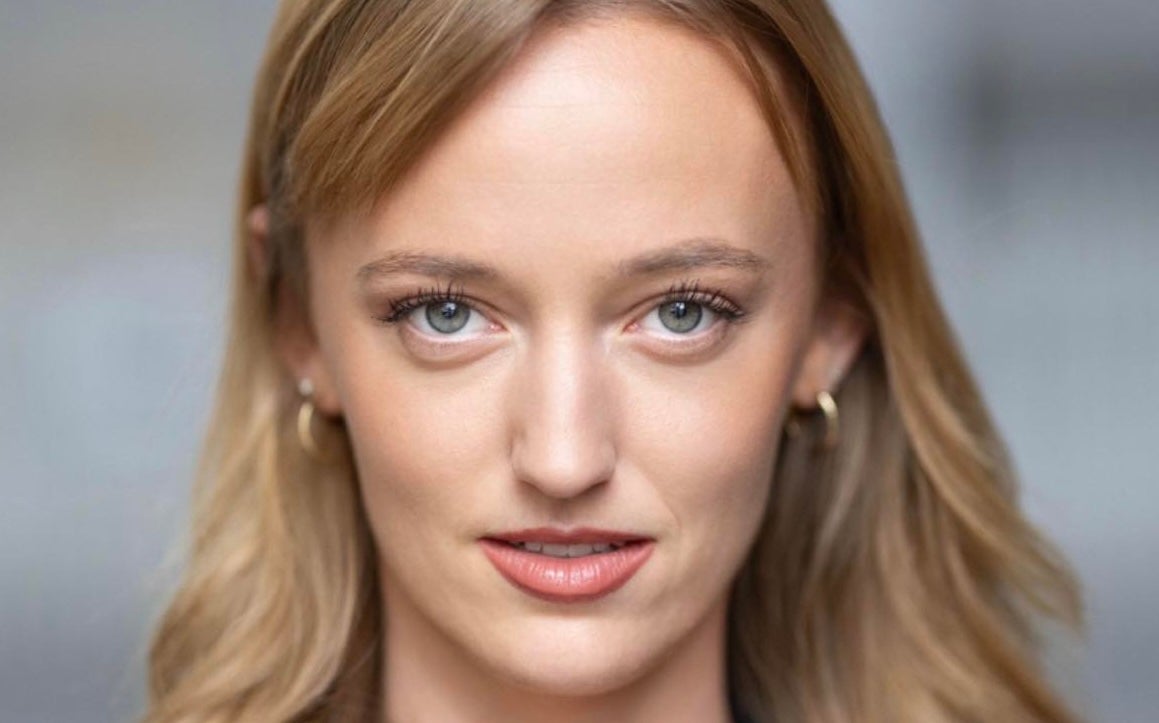 Headshot of woman with long blonde hair