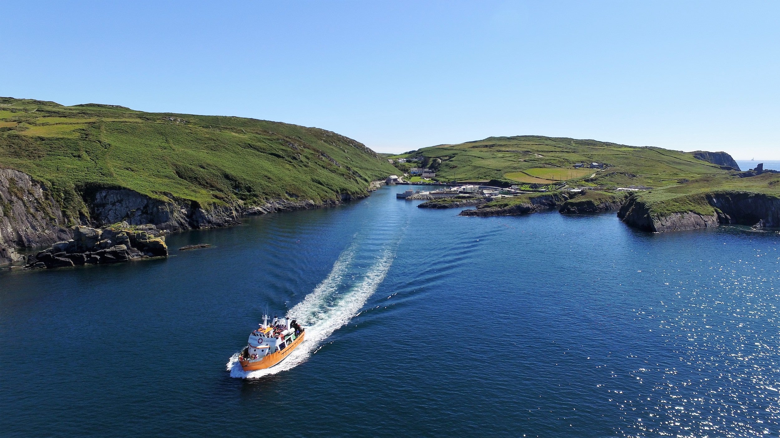 A ferry cruising by Cape Clear Island in Co Cork
