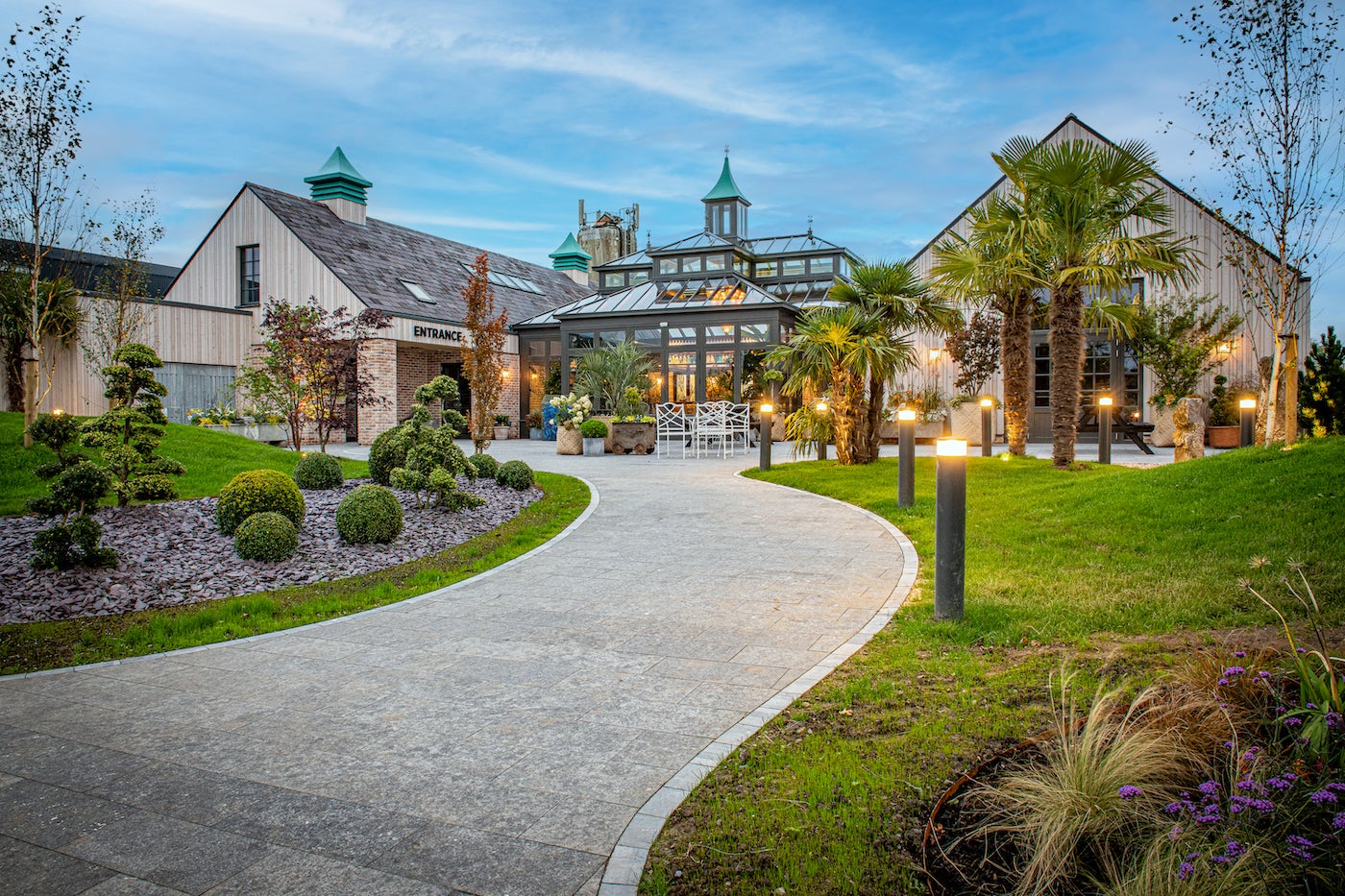 Entrance into The Shed Distillery in Drumshanbo Co Leitrim. The entrance is lined with nicely kept gardens and lights.