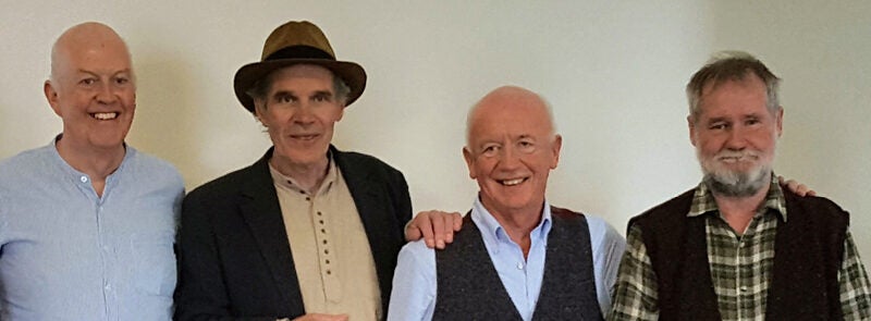 Button & Bows In Concert, a row of 4 smiling men.