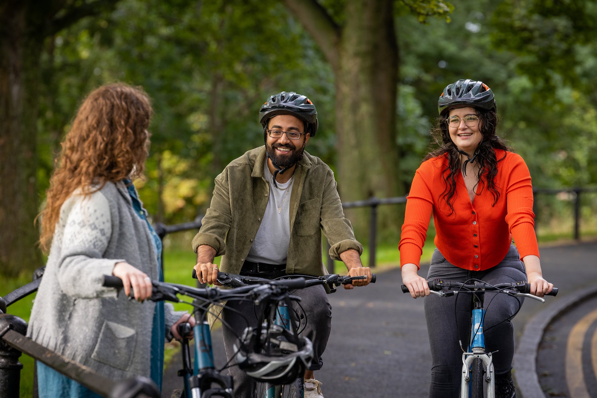 Three people cycling in Phoenix Park.
