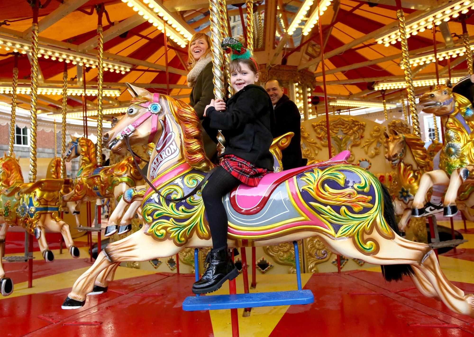 A family on a carousel ride