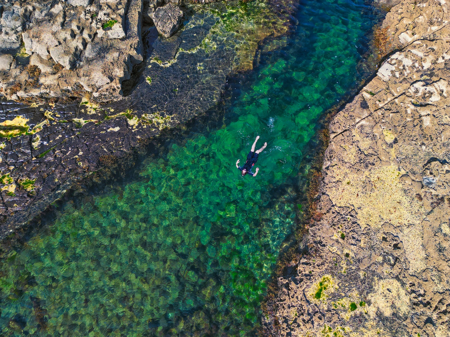 A man swimming in Poll Gorm in Easkey, County Sligo