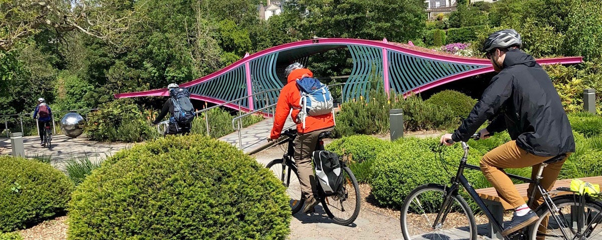 Beyond The Glass Cork Cycle Tour with cyclists passing the Sky Gardens at Fitzgerald's Park