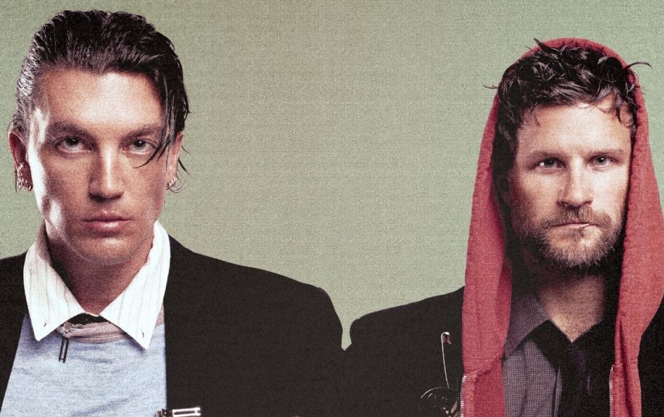 2 serious looking men starring directly ahead
