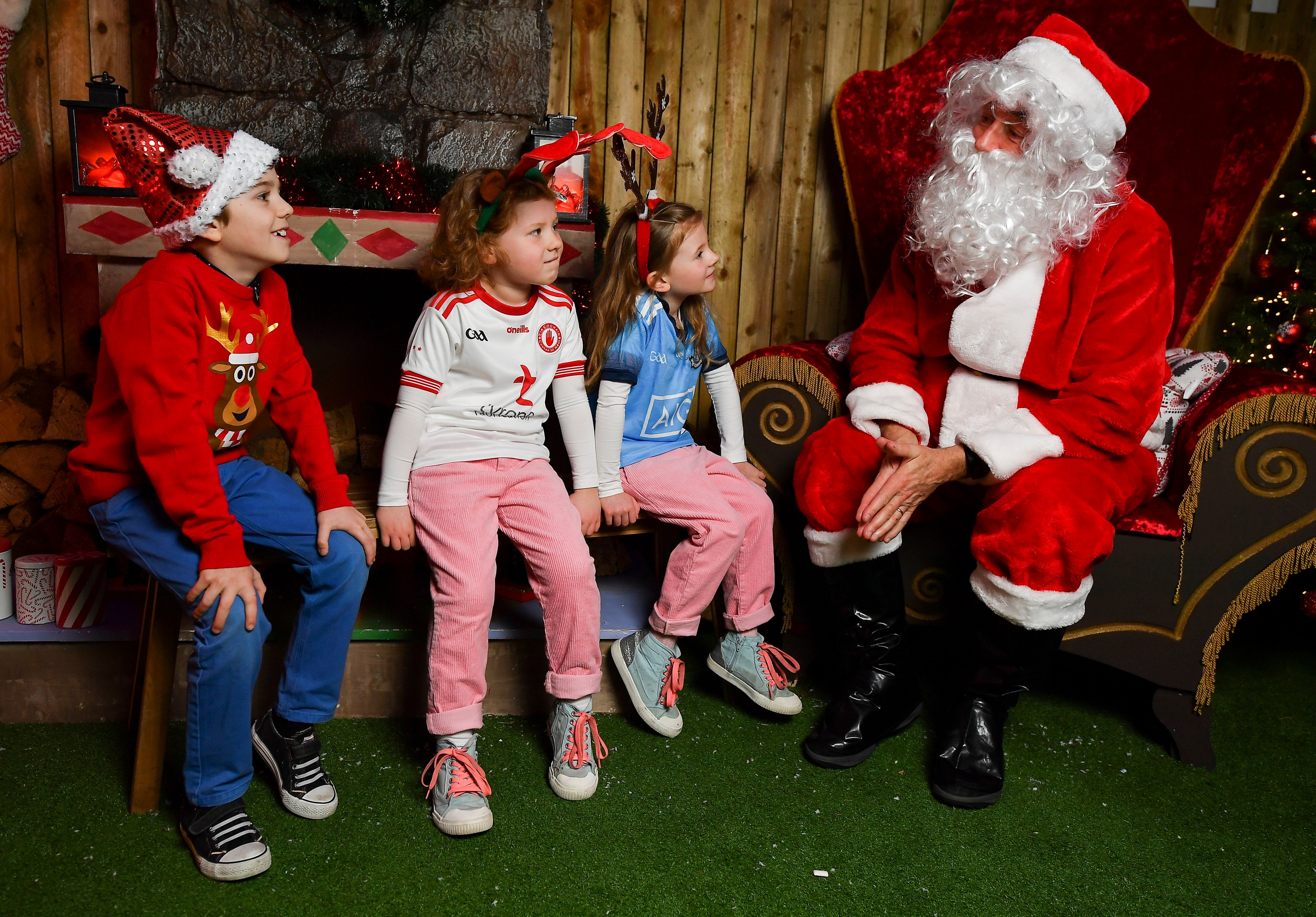 Man dressed as Santa speaks with children at the GAA Museum in Croke Park.