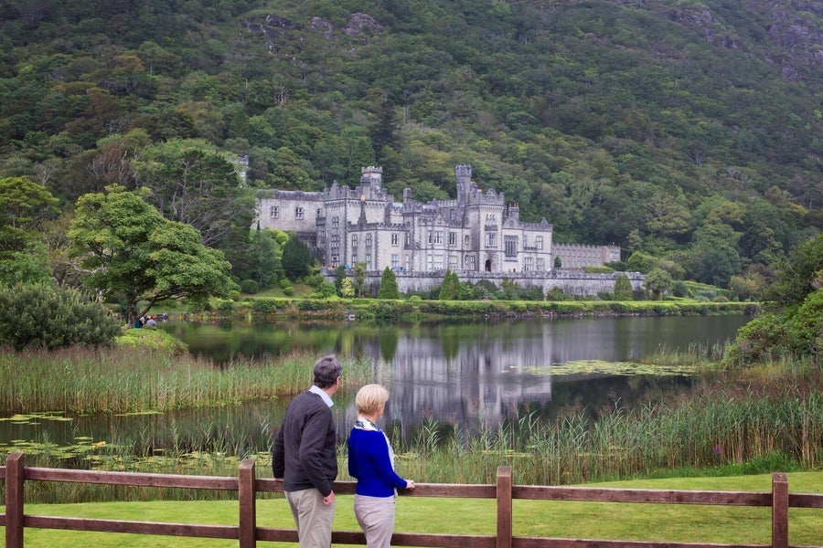 People admiring the lakeshore views at Kylemore Abbey