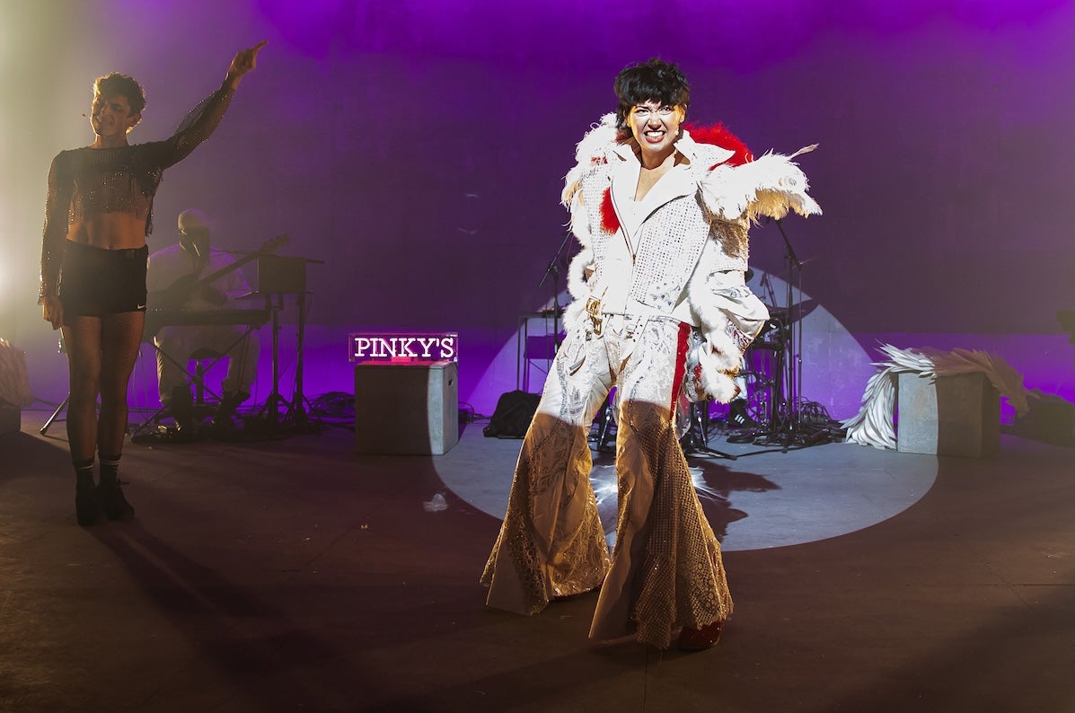0800 Cupid _ Emer Dineen _ Thisispopbaby - a person performing on a stage in a fancy, white Elvis costume