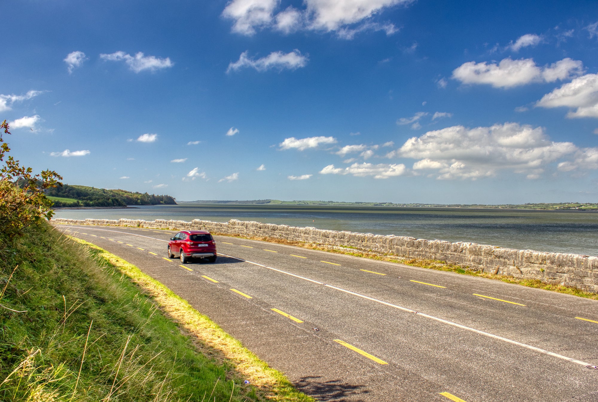 A car driving the Shannon Estuary Way in County Limerick
