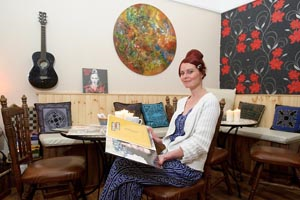 Image of lady in cafe - John Kelly Clare Champion