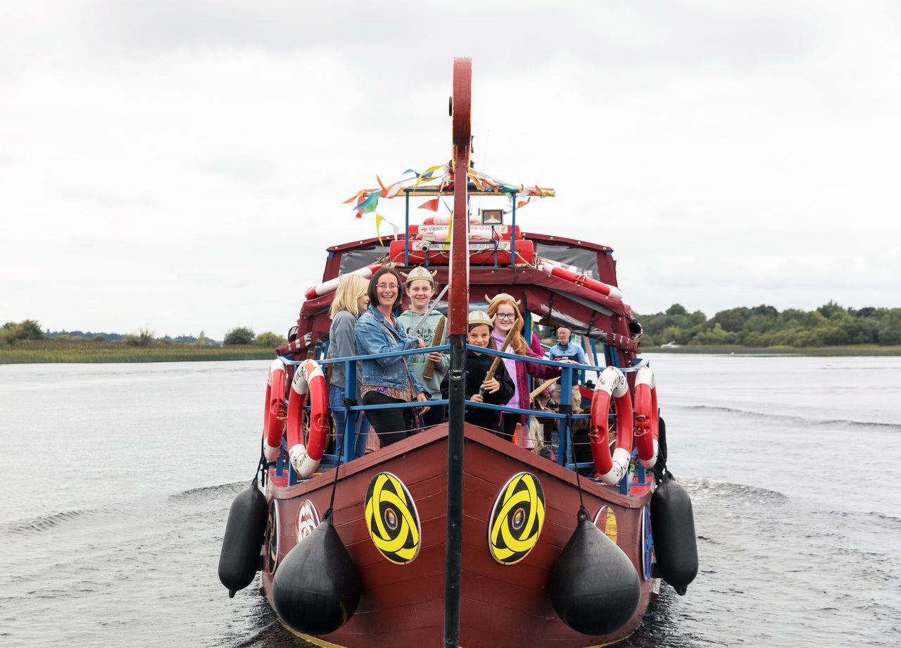 People enjoying a Viking Tours sailing to Clonmacnoise on a Viking heritage boat