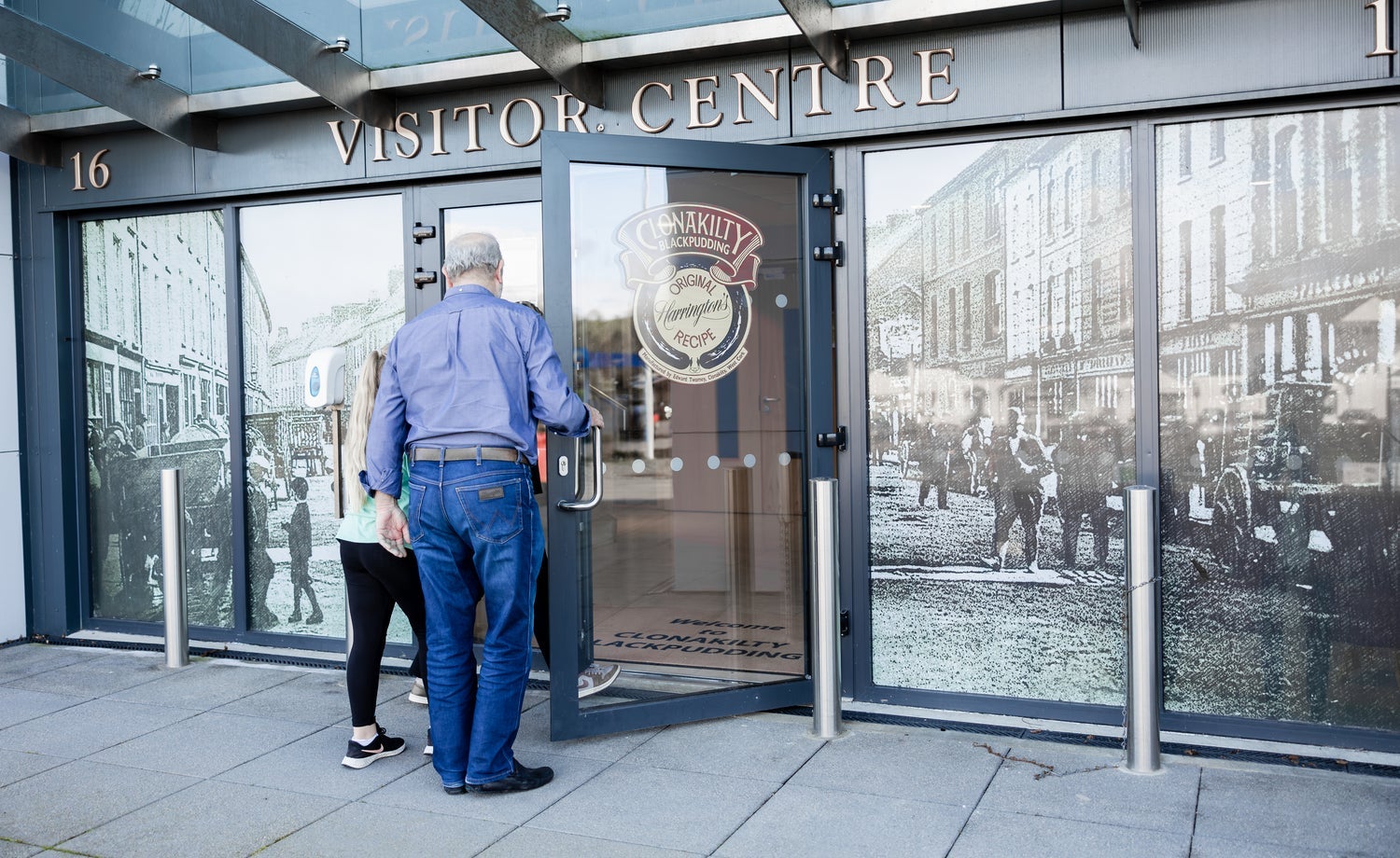 Two people opening the door to the Clonakilty Blackpudding Visitor Centre