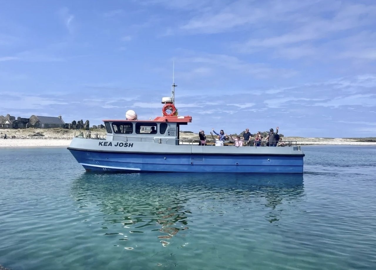 A boat with passengers on a sunny day