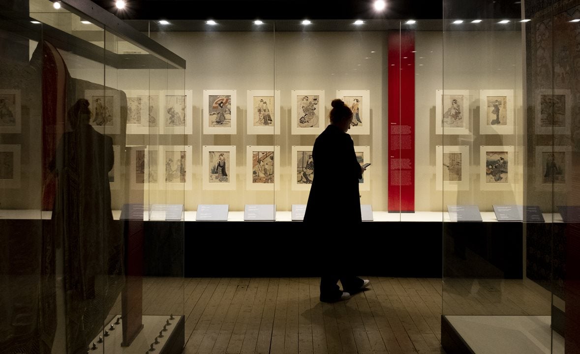 Image of a visitor exploring 'A Dubliner’s Collection of Asian Art: The Albert Bender Collection'