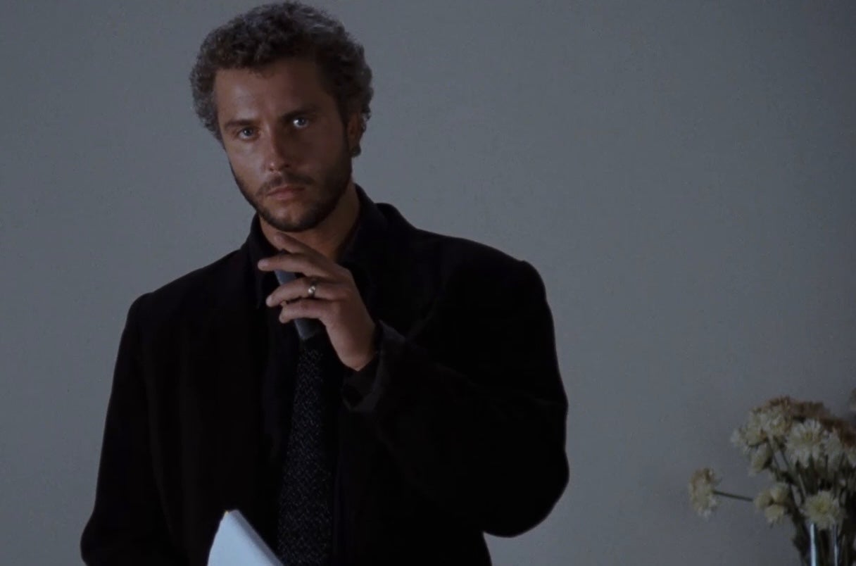 A man with a pensive expression.