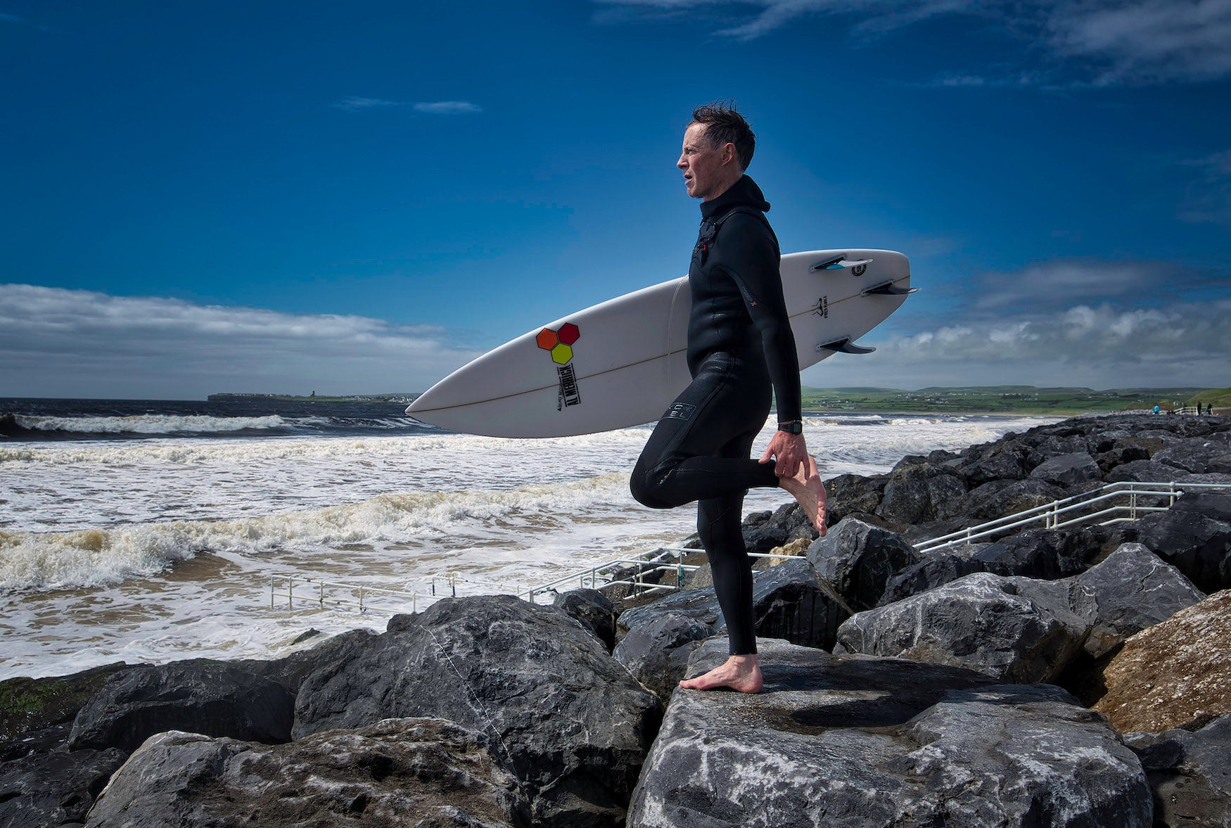 A surfer on Lahinch Beach in Co Clare
