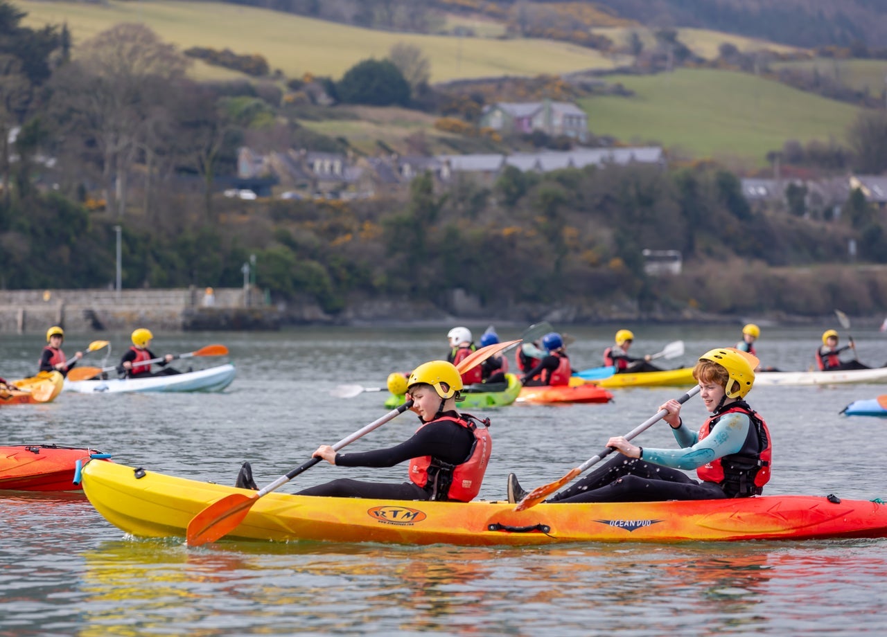 Kids kayaking on a lake