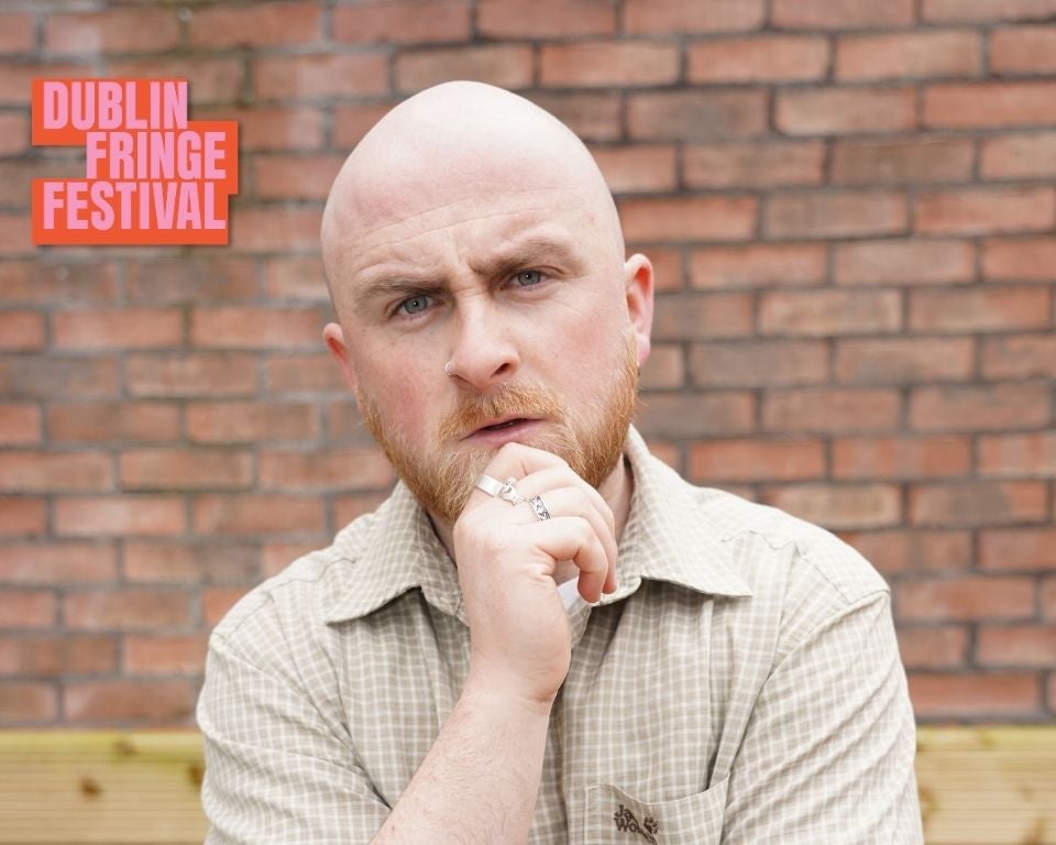 This Genuinely Did Happen - Ryan Carrick stands in front of a brick wall with a puzzled expression