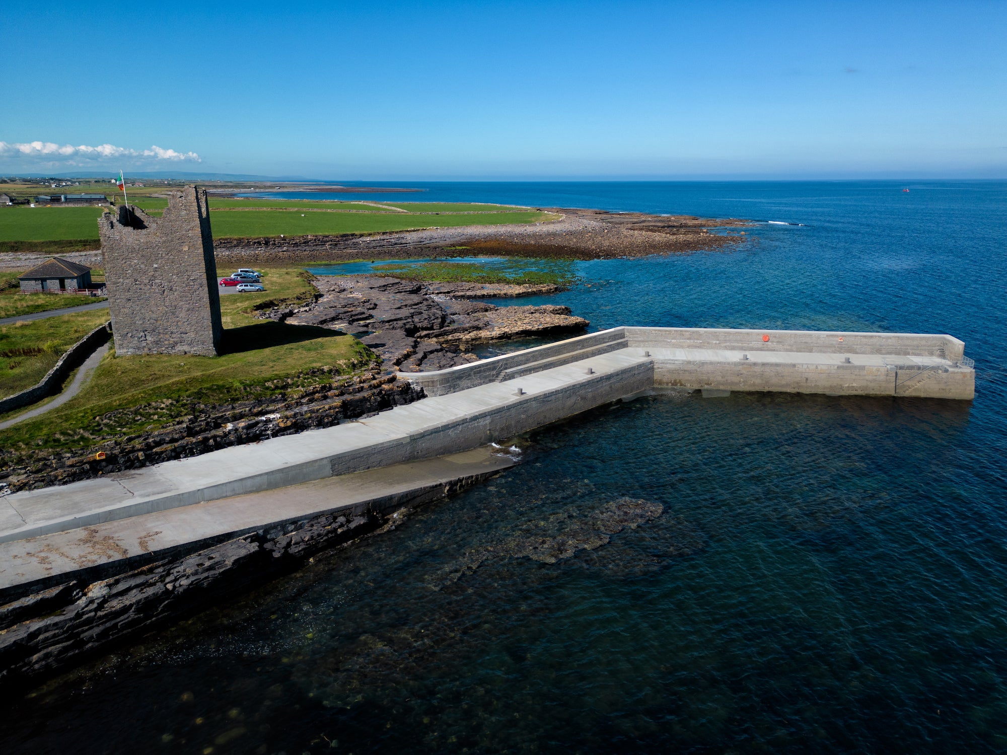 Roslee Castle and Easky Pier in Sligo on a sunny day.