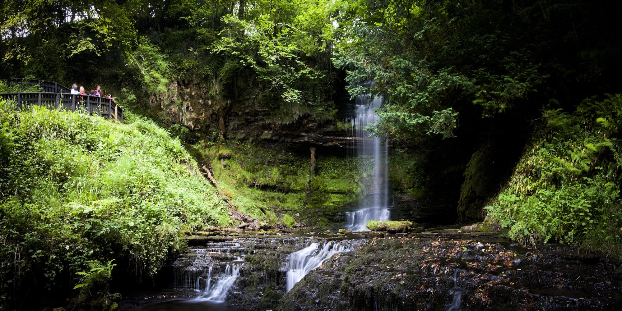 People visiting Glencar Waterfall in Co Leitrim