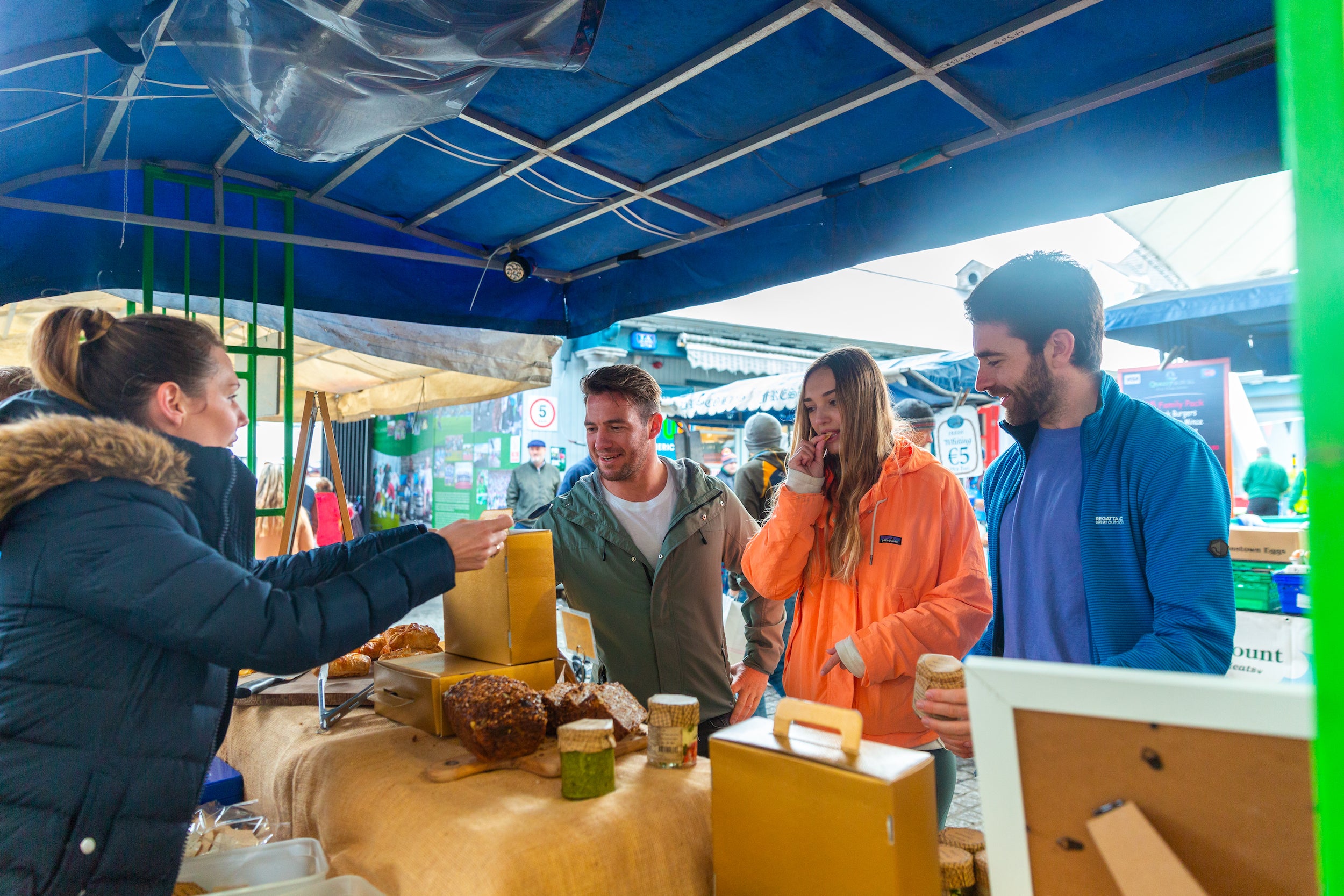 Friends tasting samples at the Milk Market.