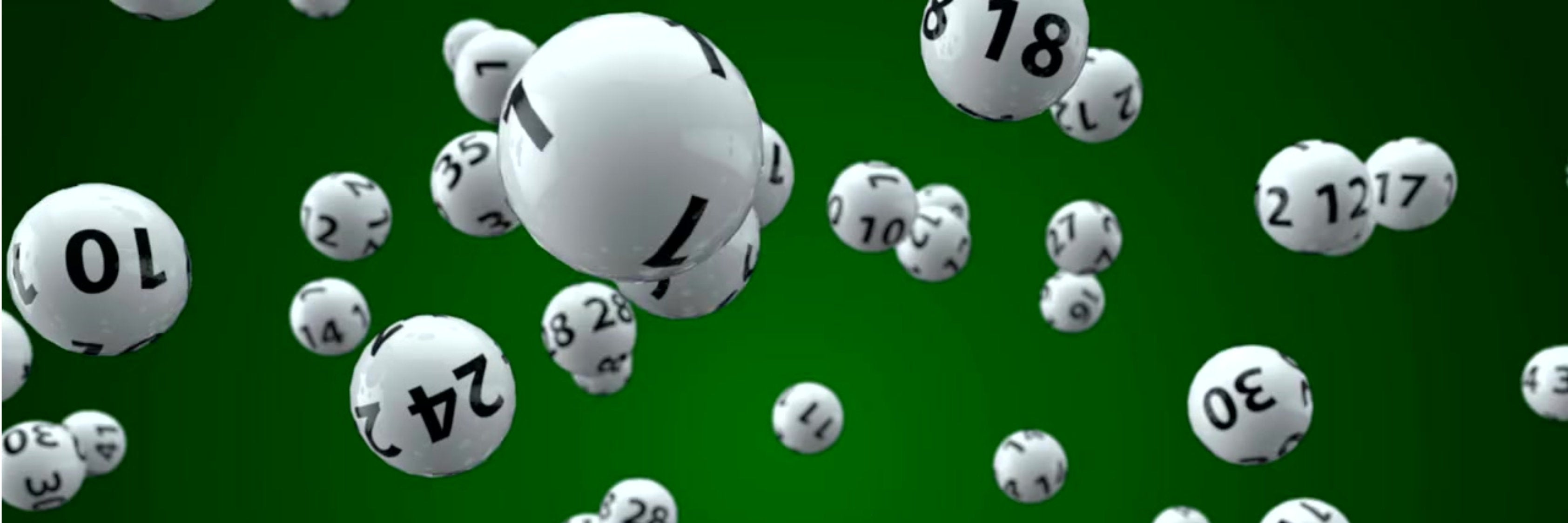 Lottery balls against a green background.