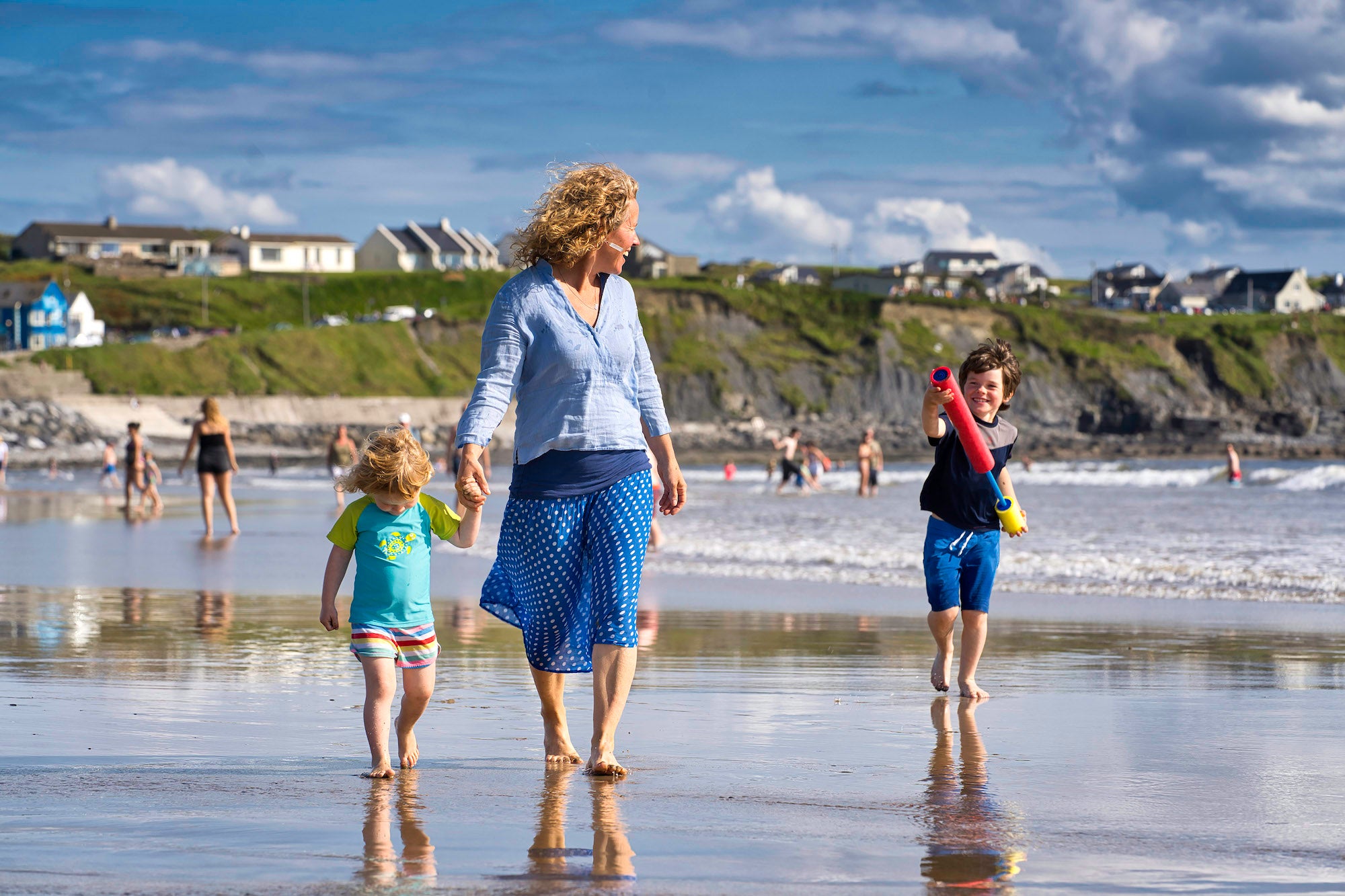 A family on Lahinch Beach in Co Clare