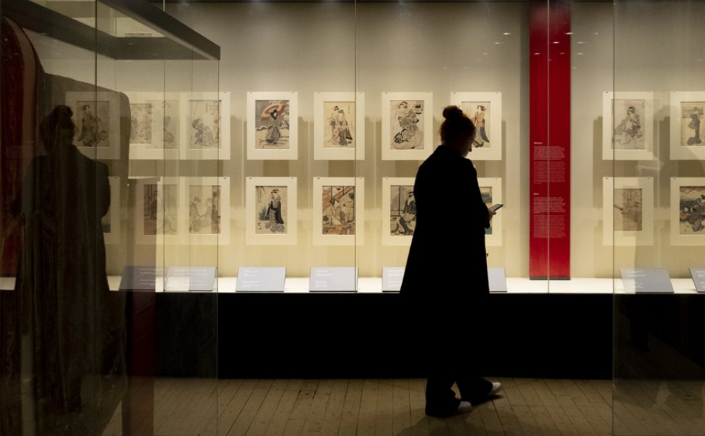 Image of a visitor exploring 'A Dubliner’s Collection of Asian Art: The Albert Bender Collection'