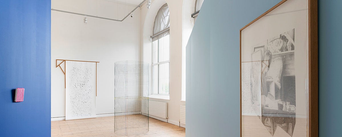 The Dock Arts Centre interior gallery area with blue walls