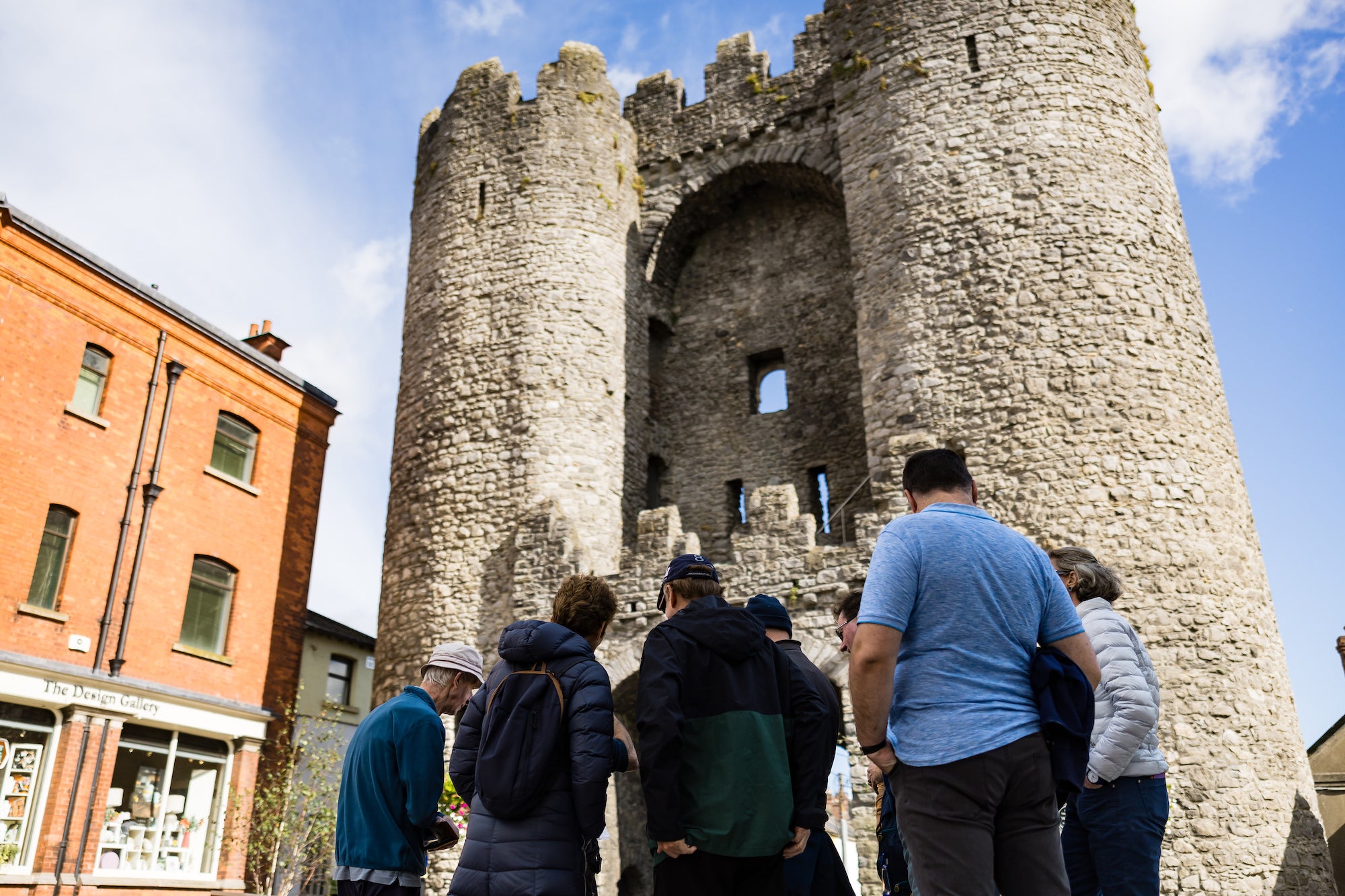 People standing at St Laurence's Gate in Drogheda, Co Louth