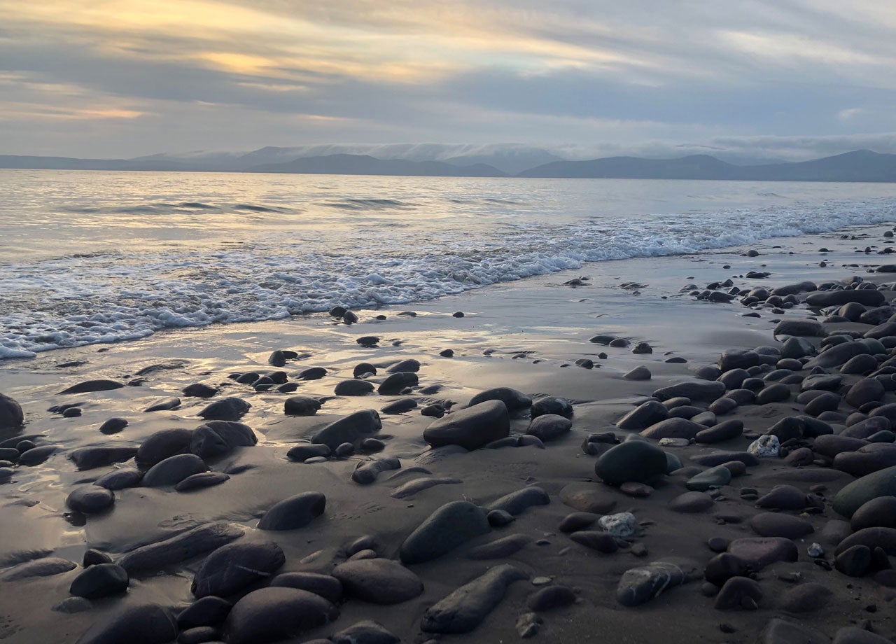View out over Rossbeigh White Strand with the mountains in the background