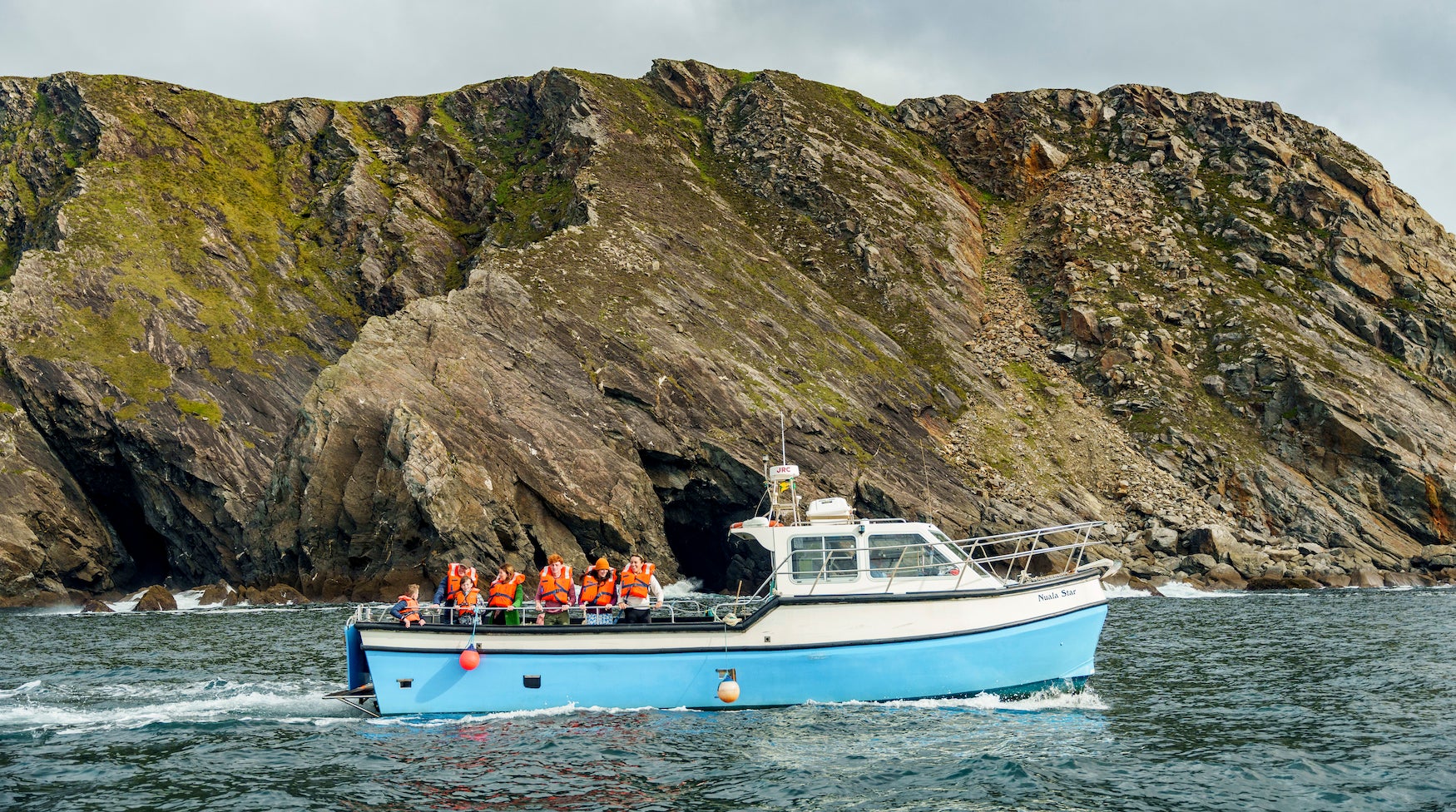 People on a boat tour of Sliabh Liag Cliffs in Co Donegal