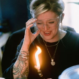 Woman with tattoo making jewellery at Silverworks