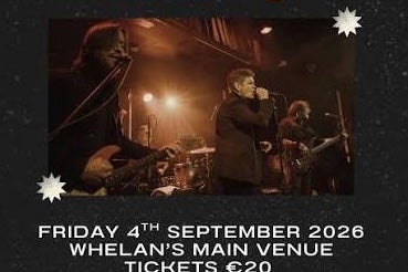 Dublin indie rock band Dakota 66, 3 men on a dark stage playing and singing