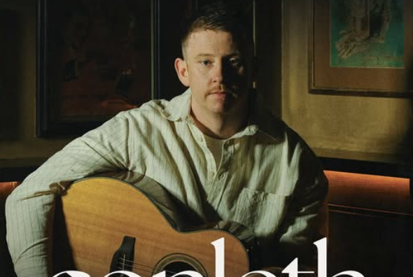Irish singer-songwriter Conleth McGeary with a guitar.