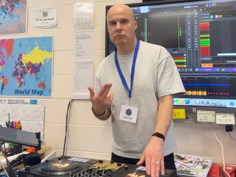 A man operating DJ equipment.