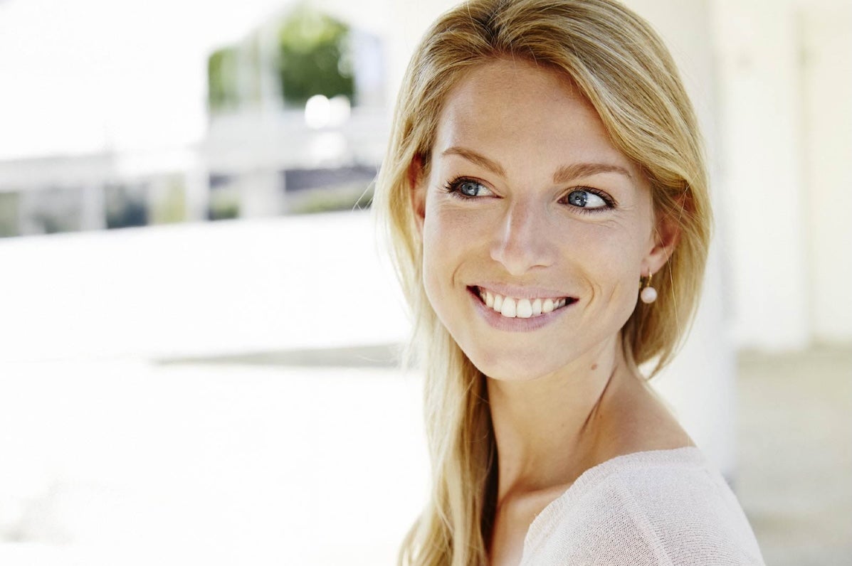Festival of Voice: Laurence Servaes Song Recital, headshot of smiling woman against blurry white background.