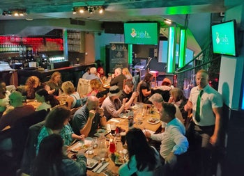 Irish Songs and Stories view of crowd enjoying food.