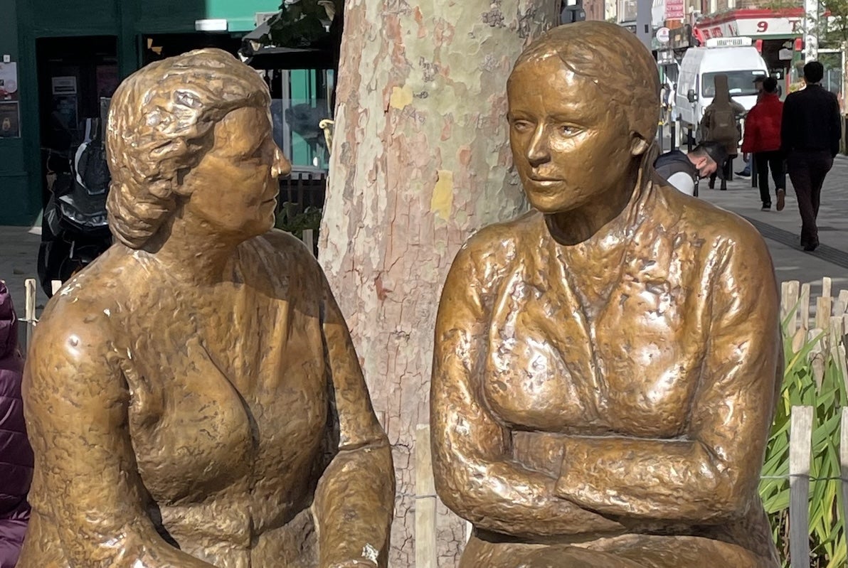 Friendly Tour Guide at the bronze Meeting Place Statue of a woman