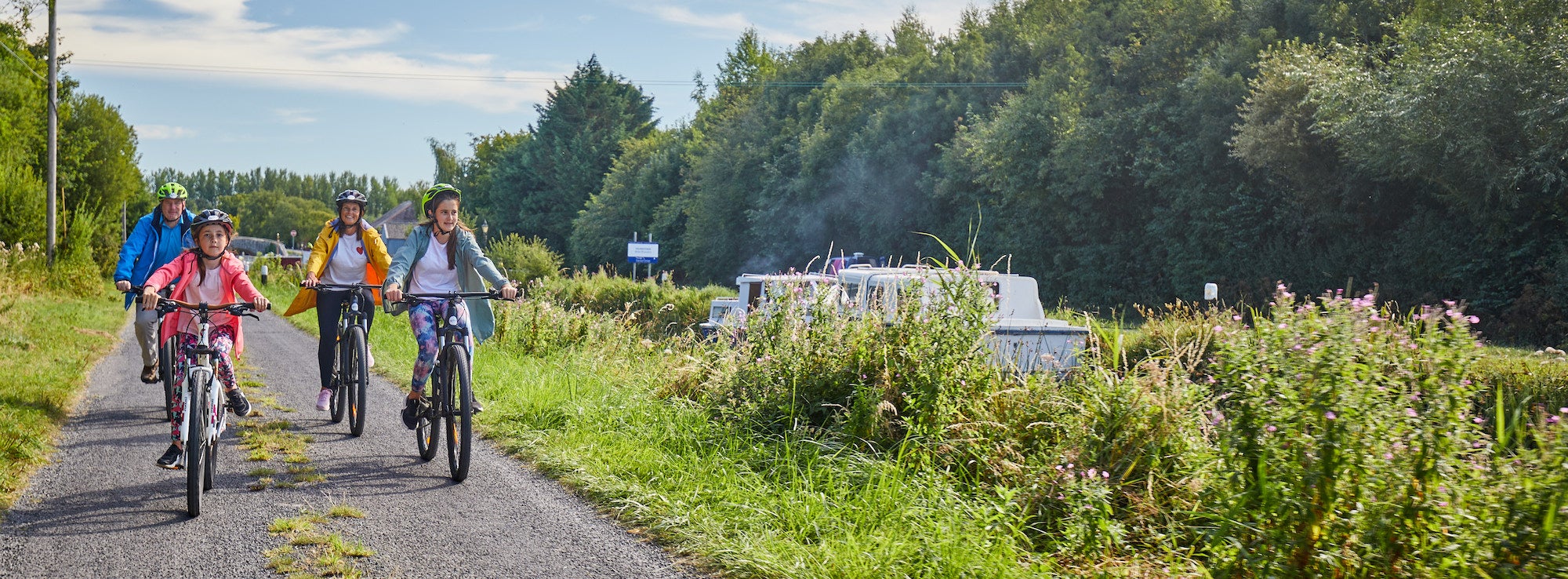 A family of four cycling along the Barrow Blueway in Vicarstown, County Laois