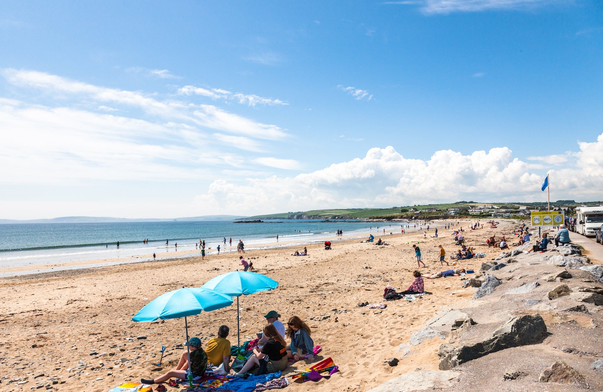 People on Garrylucas Beach in Cork on a sunny day