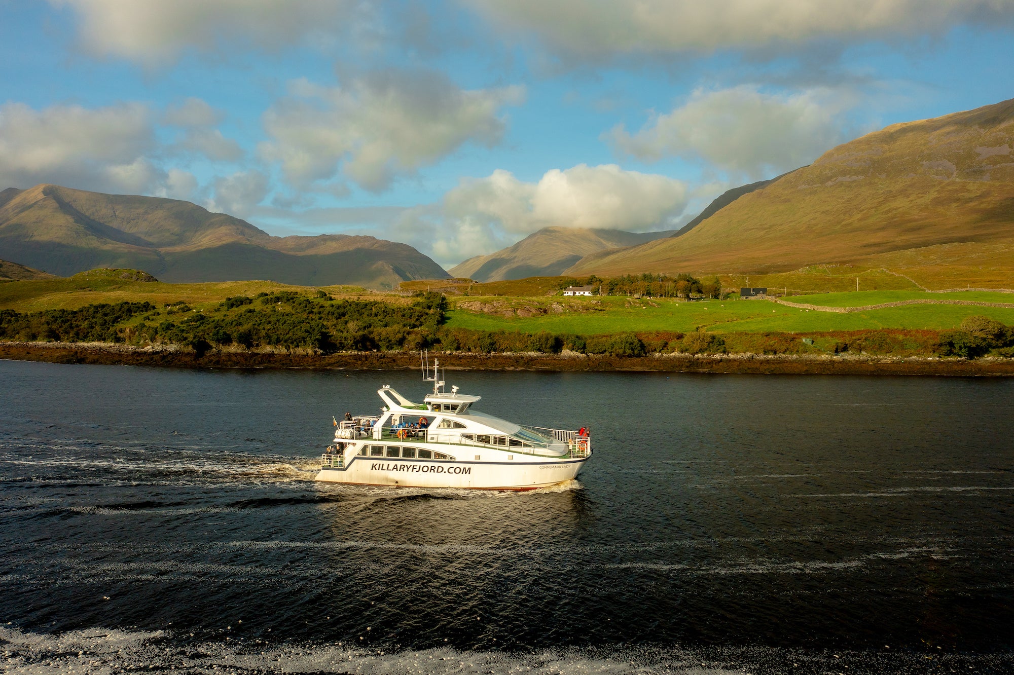 A boat tour cruising down the Killary Fjord in Co Galway
